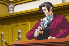 a man in a red suit and white tie is pointing