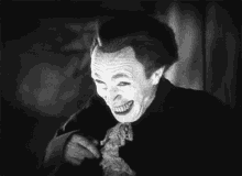 uncomfortable joker grin evil face evil laugh