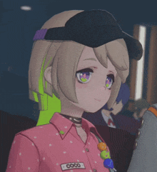a close up of a girl wearing a pink shirt that says coco on it