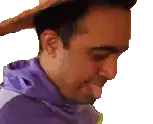 a man in a cowboy hat is sticking his tongue out .