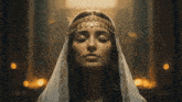 a woman with her eyes closed is wearing a veil and a headband