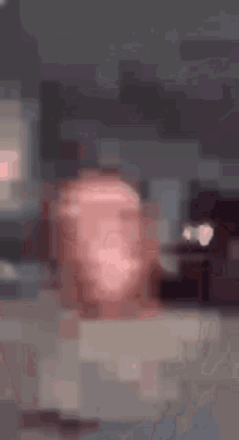 a blurry picture of a person 's face laying on a couch .