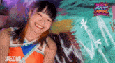 a girl is smiling in front of a sign that says ' x ' on it