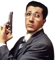 a man in a suit and tie is holding a gun in his right hand
