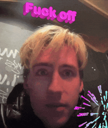 a close up of a man 's face with the words " fuck off " above it