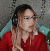 a woman wearing headphones and glasses has a sticker on her shirt that says ' i love you '