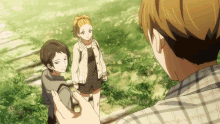 a man in a plaid shirt is taking a picture of a girl