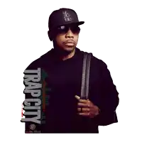 a man wearing a hat and sunglasses is standing in front of a trap city logo
