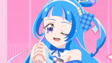 a girl with blue hair and purple eyebrows is singing into a microphone