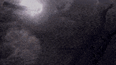 the sun shines through the clouds in a dark room