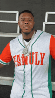 a man wearing a white and red family jersey