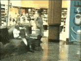 a man standing in a store with a sign that says coffee on it