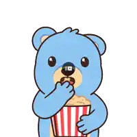 a blue teddy bear is holding a striped bucket of popcorn and eating it
