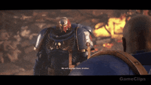 a video game screen shows a space marine talking to another space marine