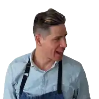 a man wearing a blue shirt and black suspenders is making a face
