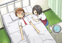 a boy is laying in a hospital bed while a girl looks on