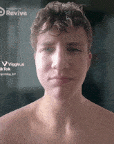 a shirtless young man 's face is being made with revive