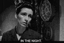 a black and white photo of a woman and the words in the night