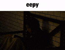 a screenshot of a website called eepy shows a man in a dark room