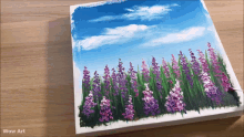 a painting of purple and white flowers on a wooden table with wow art written on the bottom