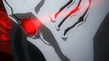 a close up of a person 's face with a red light shining through it