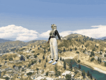 a person standing on top of a hill with a river in the background