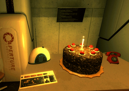 A GIF from Portal's Aperture Laboratories with an appetizing cake glowing on a desktop.