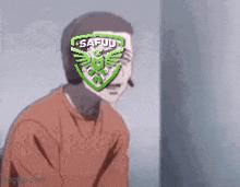 a man wearing headphones is smiling with a badge on his head that says safuu .