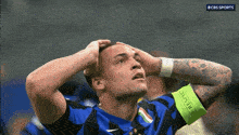 a soccer player wearing a armband that says respect
