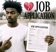 a man is holding a job application with a broken heart on it