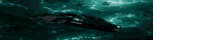 a blurred image of a person swimming in the ocean