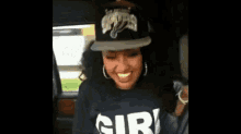 a woman wearing a new york yankees hat and a shirt that says cir