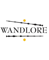 a logo for wandlore with two wands and a yellow ball