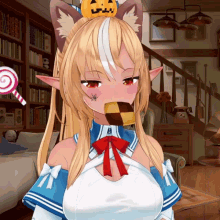a girl with a pumpkin on her head is eating a piece of cake