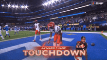 ja 'marr chase touchdown is displayed on a screen during a football game