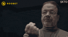 a man giving a thumbs up with the words looks good in the background