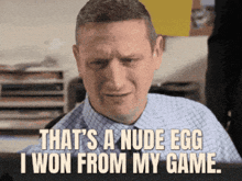 a man is sitting in front of a computer with the words that 's a nude egg i won from my game