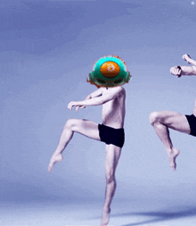 a man with a balloon on his head with the number 8