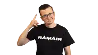 a man wearing a black t-shirt with ramair written on it