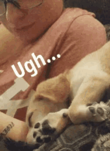 a person laying on a couch with a puppy laying on their lap and a caption that says ugh ..