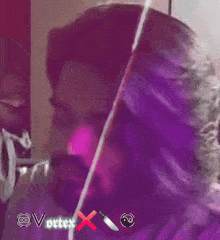 a close up of a person 's face in a purple background