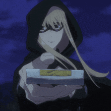 a woman in a black cape is holding a box
