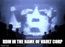 a group of people are watching a video of a man 's face .