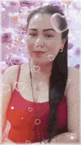 a woman in a red tank top is surrounded by purple flowers and hearts