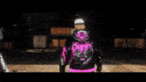 three men wearing black and pink hoodies with the word fear on the front