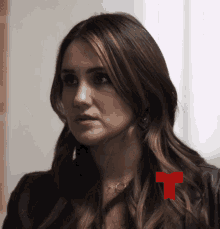 a woman with a red t on her neck