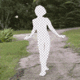 a silhouette of a woman is walking down a path