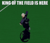 a man is kneeling down on a soccer field with the caption " king of the field is here "