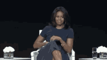 A Proud Mic Drop From The First Lady GIF - Michele Obama Drop The Mic Boom GIFs
