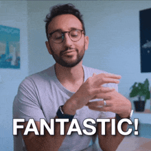a man with glasses and a beard is saying fantastic
